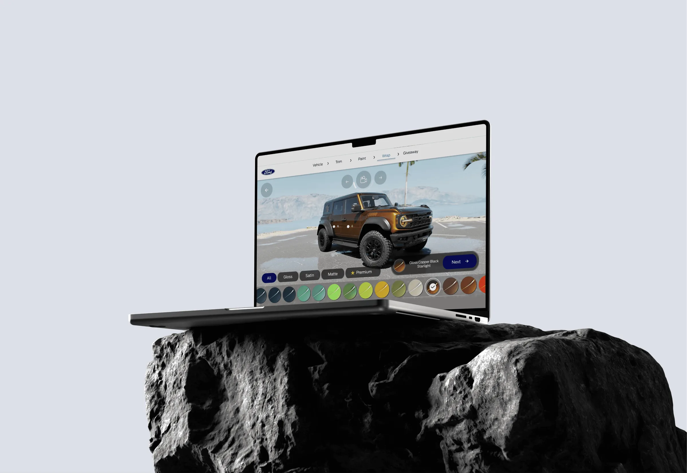 Ford wrap configurator on a laptop — Bronco with real-time film and color selection